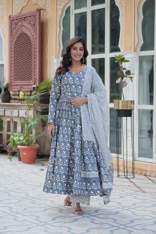 Woman wearing a blue pure cotton kurti set with white floral print and soft dupatta, ideal for all-day comfort.