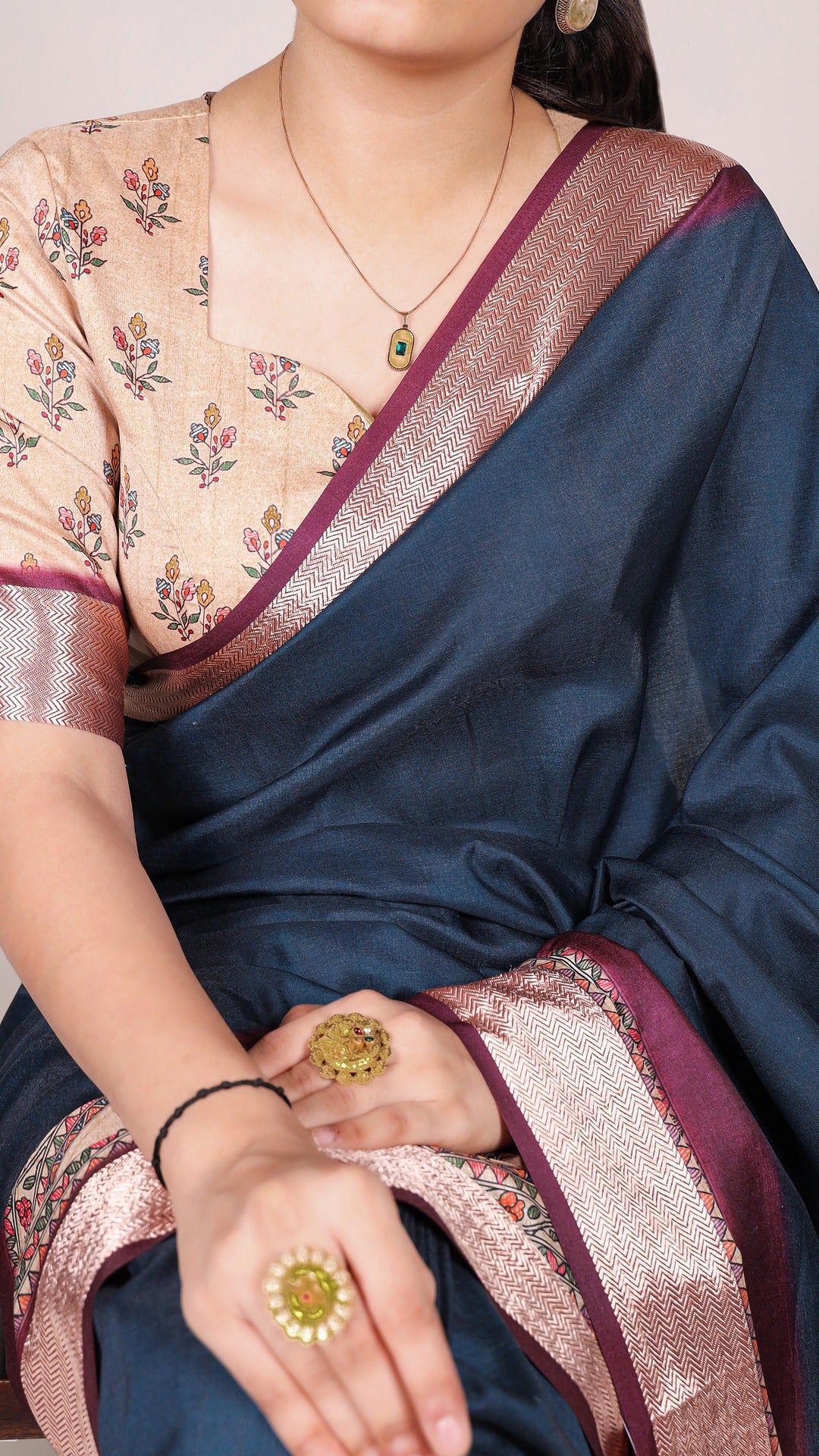 A traditional blue tasar silk printed saree with a viscose border.