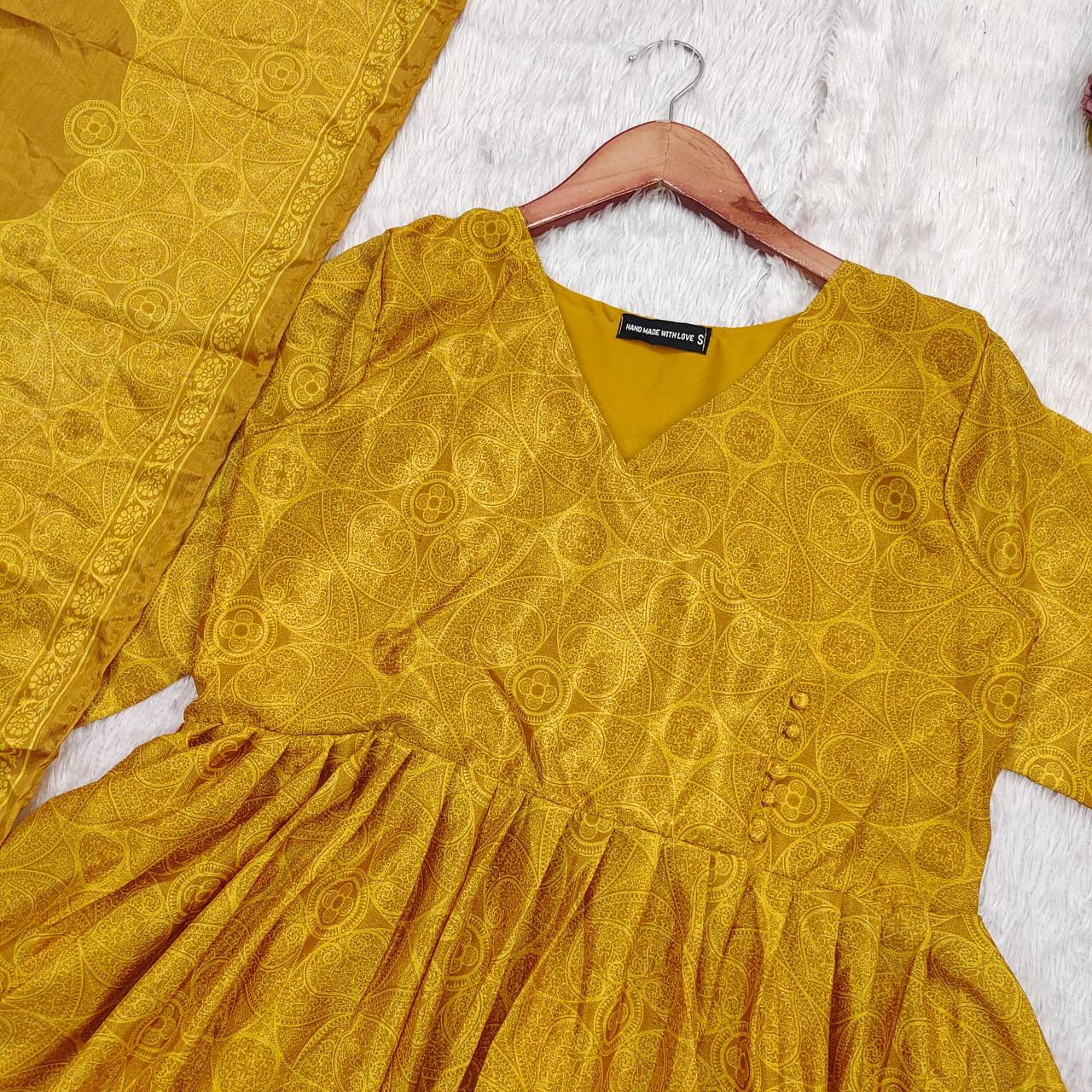 Close-up of the Golden Bandhani Anarkali Suit Set bodice. Ethnic dress.