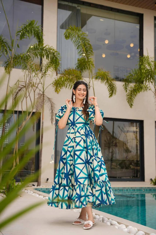 Model wearing the Sajda Maxi Dress in blue-dark blue-white geometric pattern.