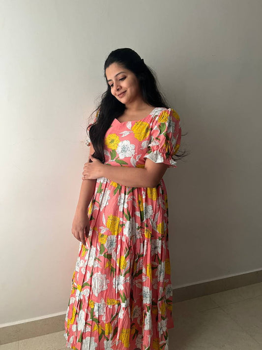 Model in a pink cotton floral maxi dress, Indian summer style.