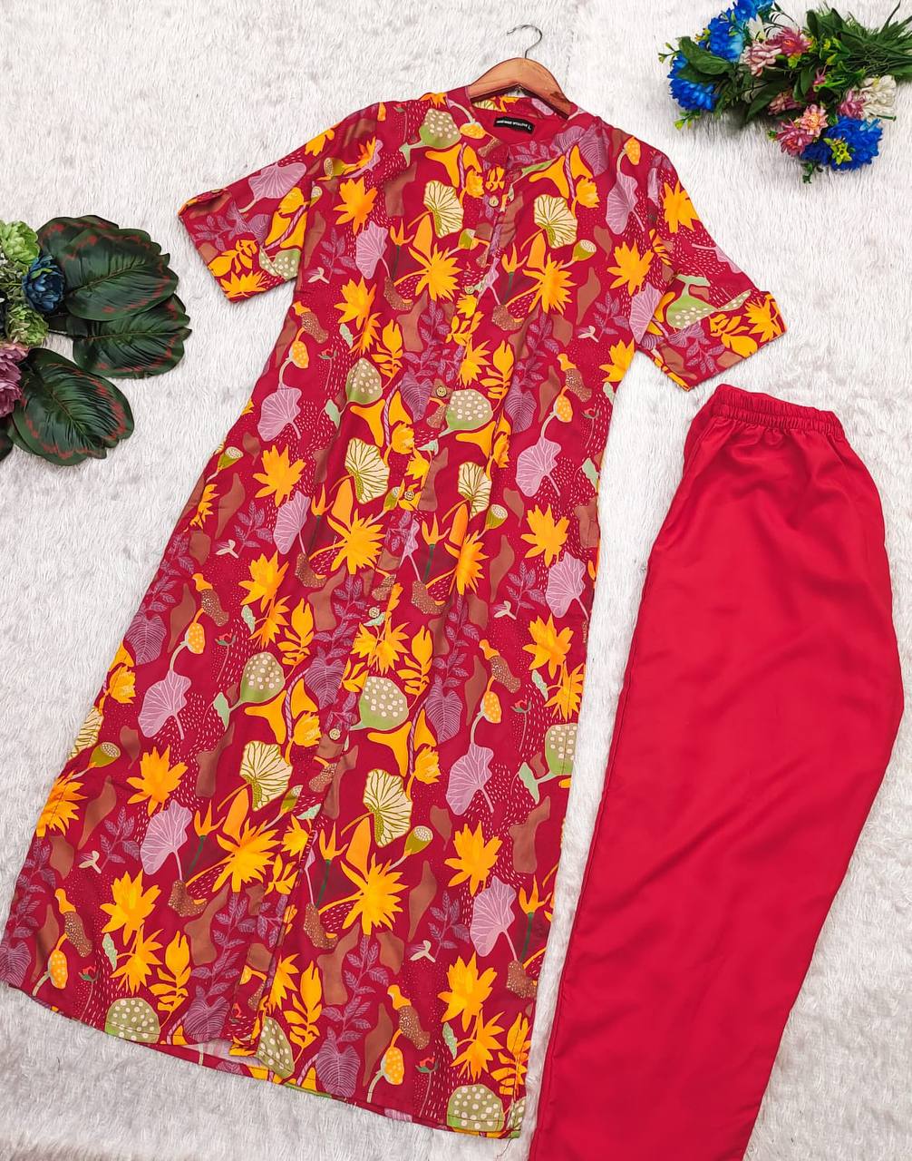 Red Forest floral A-line cotton kurti and matching red bottom displayed together, floral motif visible.