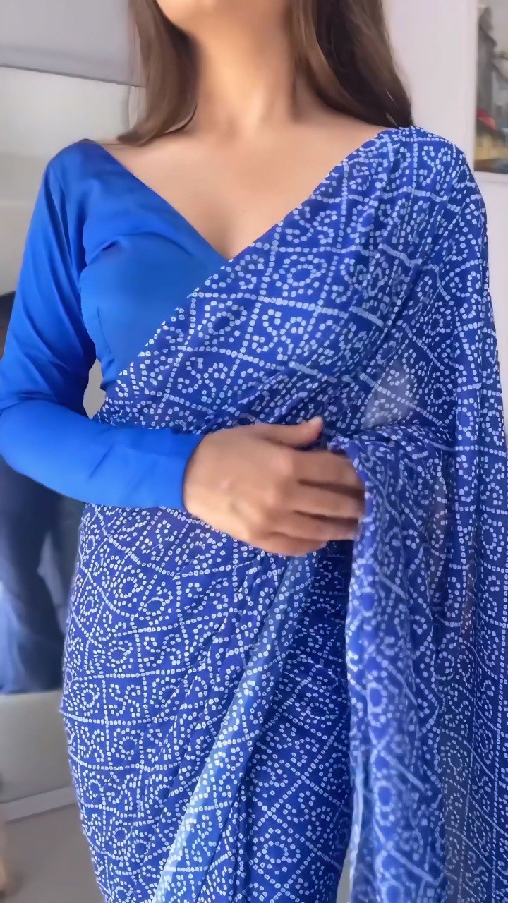 Close-up of the ready to wear blue georgette saree showing the fabric and print.