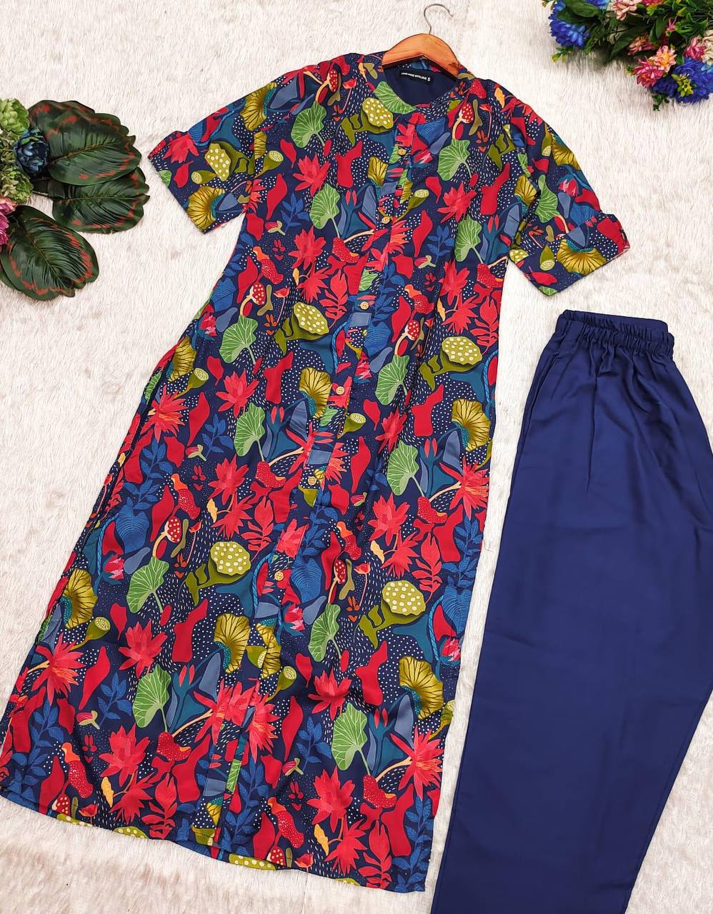 Blue Forest Kurti Set displayed flat with matching navy bottoms and vivid prints.