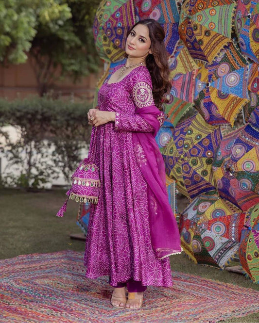 Woman wearing stylish purple digital print gown palazzo set