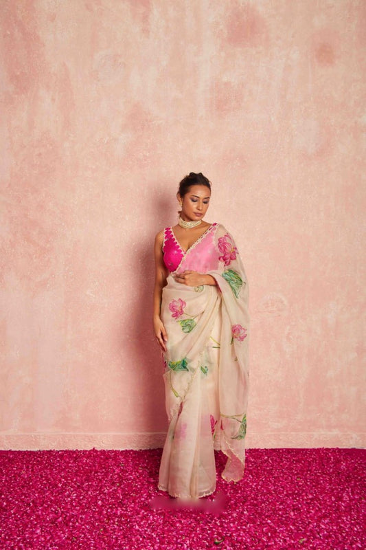 Model displaying floral pattern of the light pink organza silk saree.