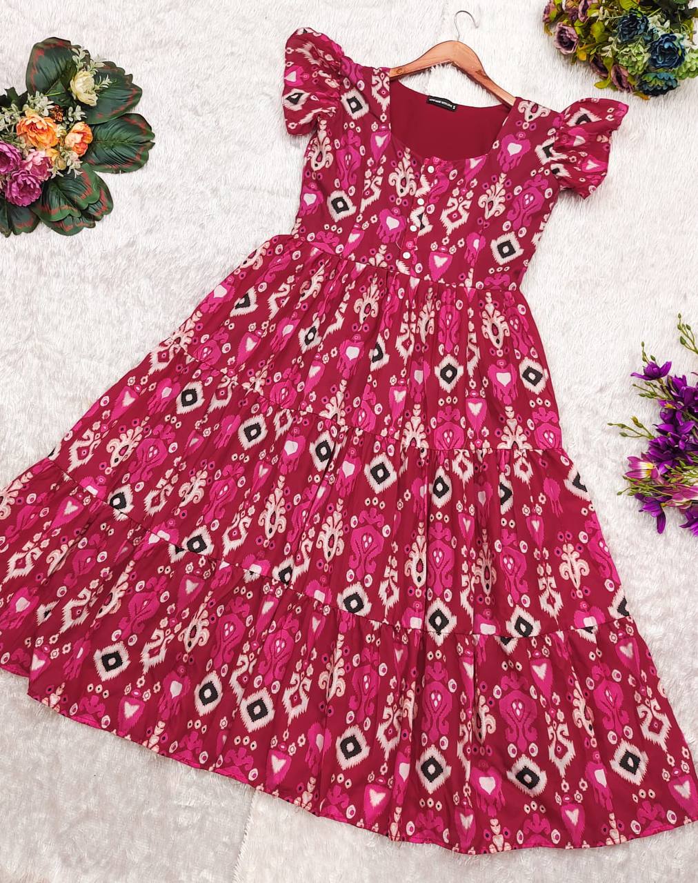 Full view of the Dhano Maxi pink Patola dress on a white background.