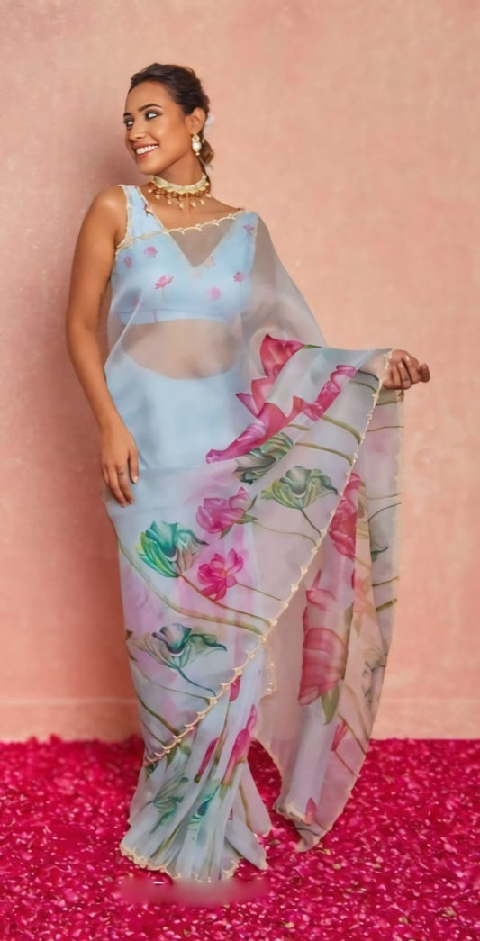 Model smiling in a ready to wear floral printed organza silk saree.