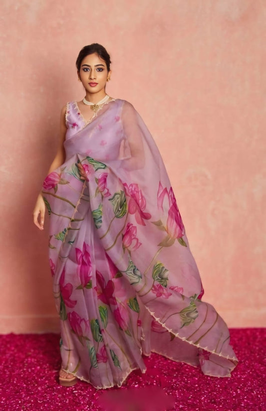 Full-length shot of model in a lightweight floral organza saree, ready to wear.