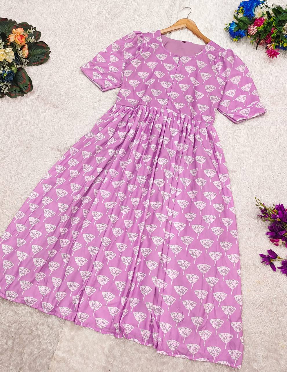 Full view of the Ghibli Maxi dress in lilac with white print, laid flat to display the entire design.