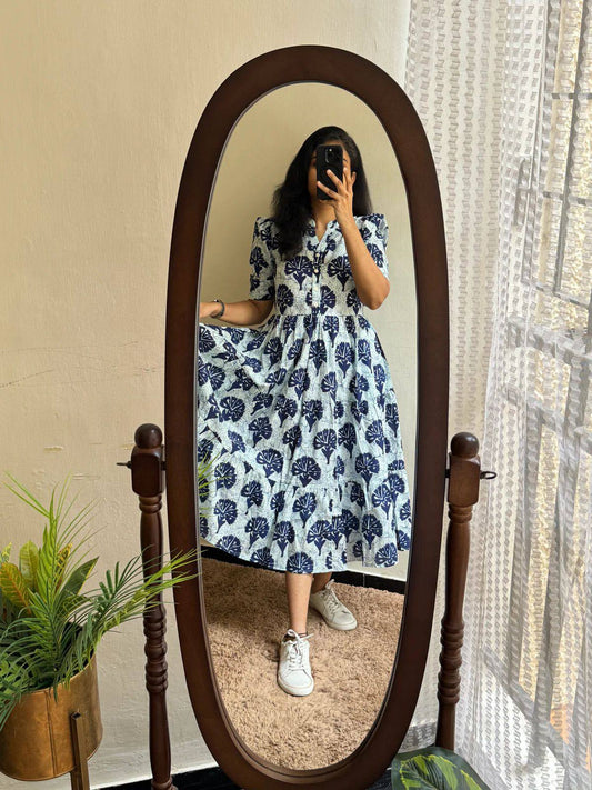 Stylish floral maxi dress in soft cotton with tiered skirt and relaxed fit.