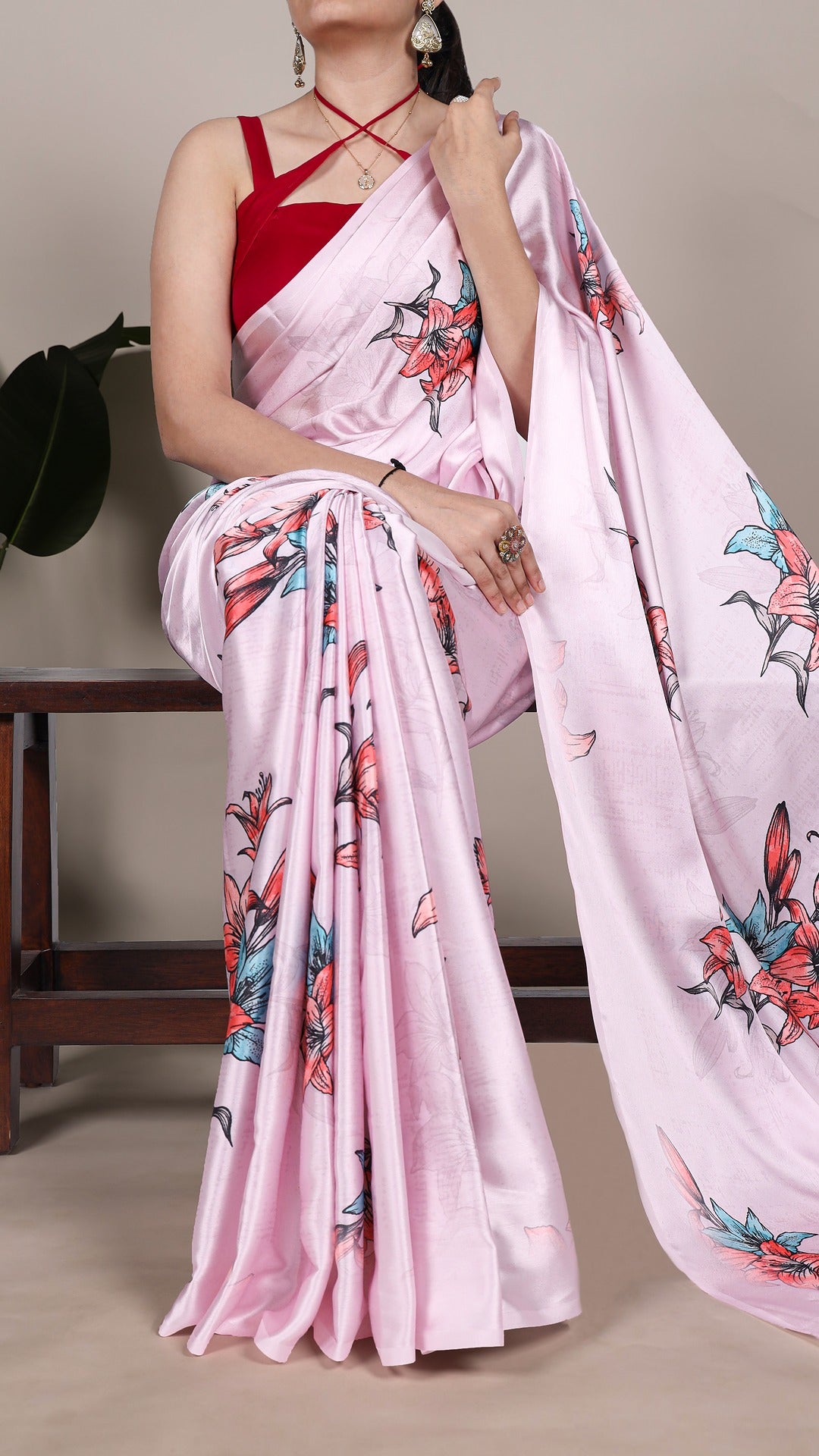 Satin saree with delicate floral artwork.