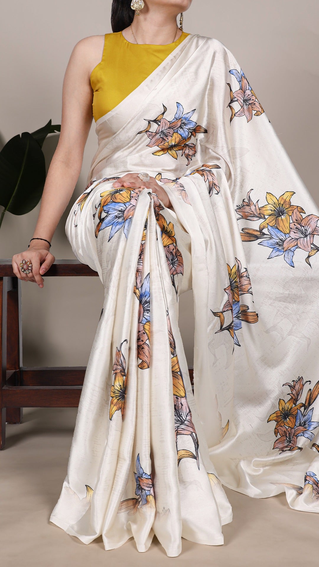 Detailed floral patterns on a high-quality satin saree.