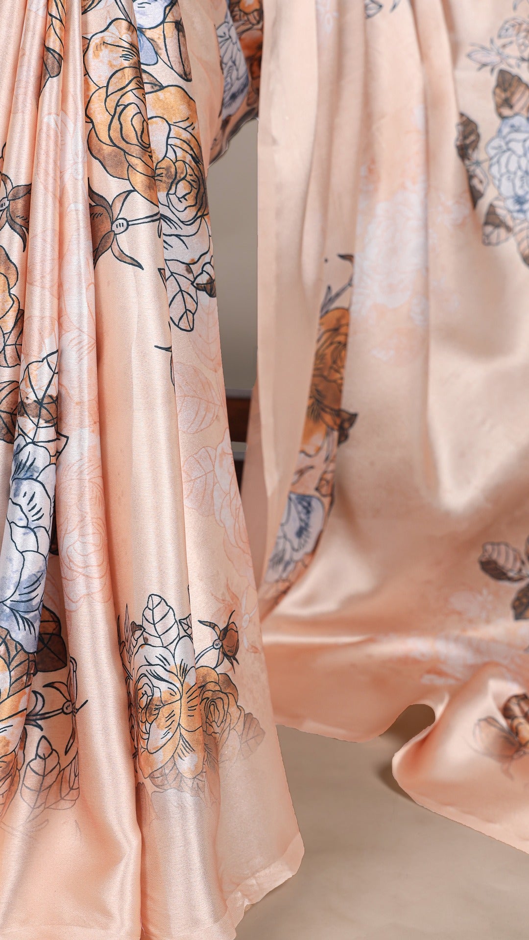 Luxurious floral satin saree for a graceful look.