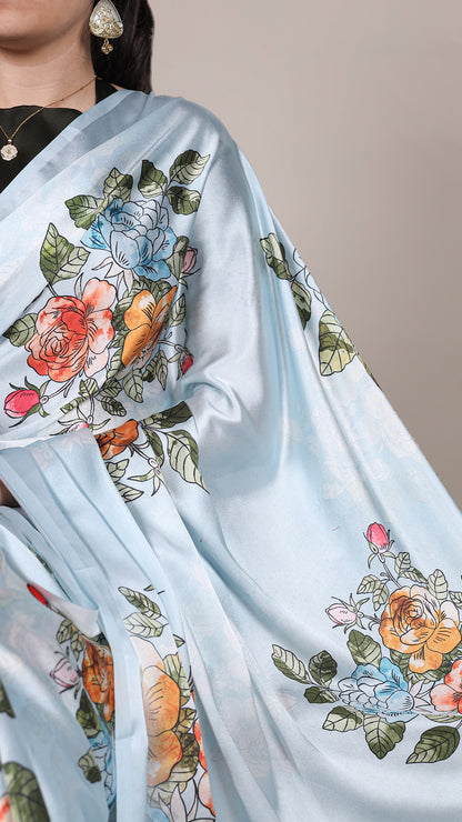 Satin saree with intricate floral details.