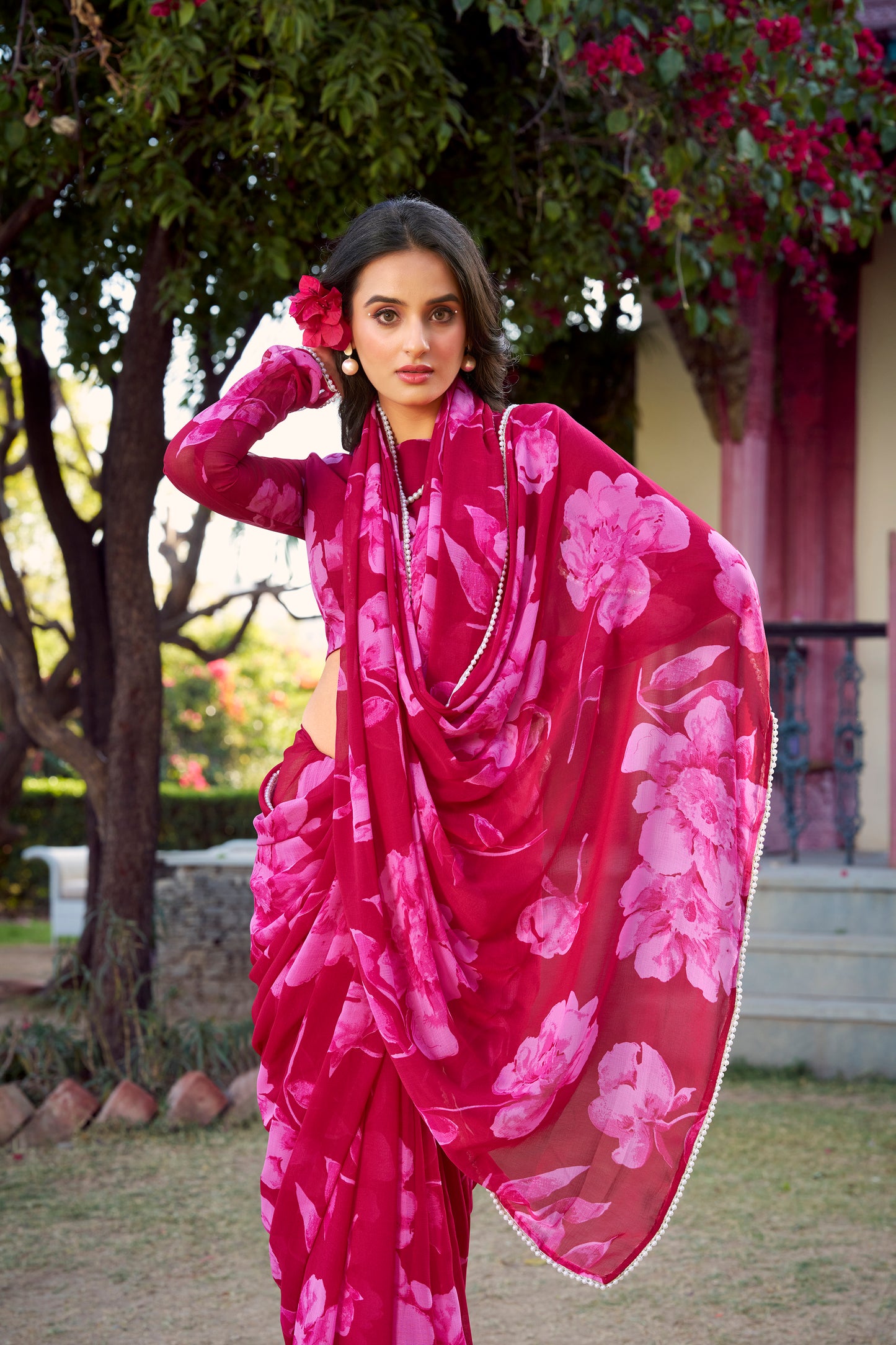 Elegant Floral Saree in breathable blue fabric with pearl accents.