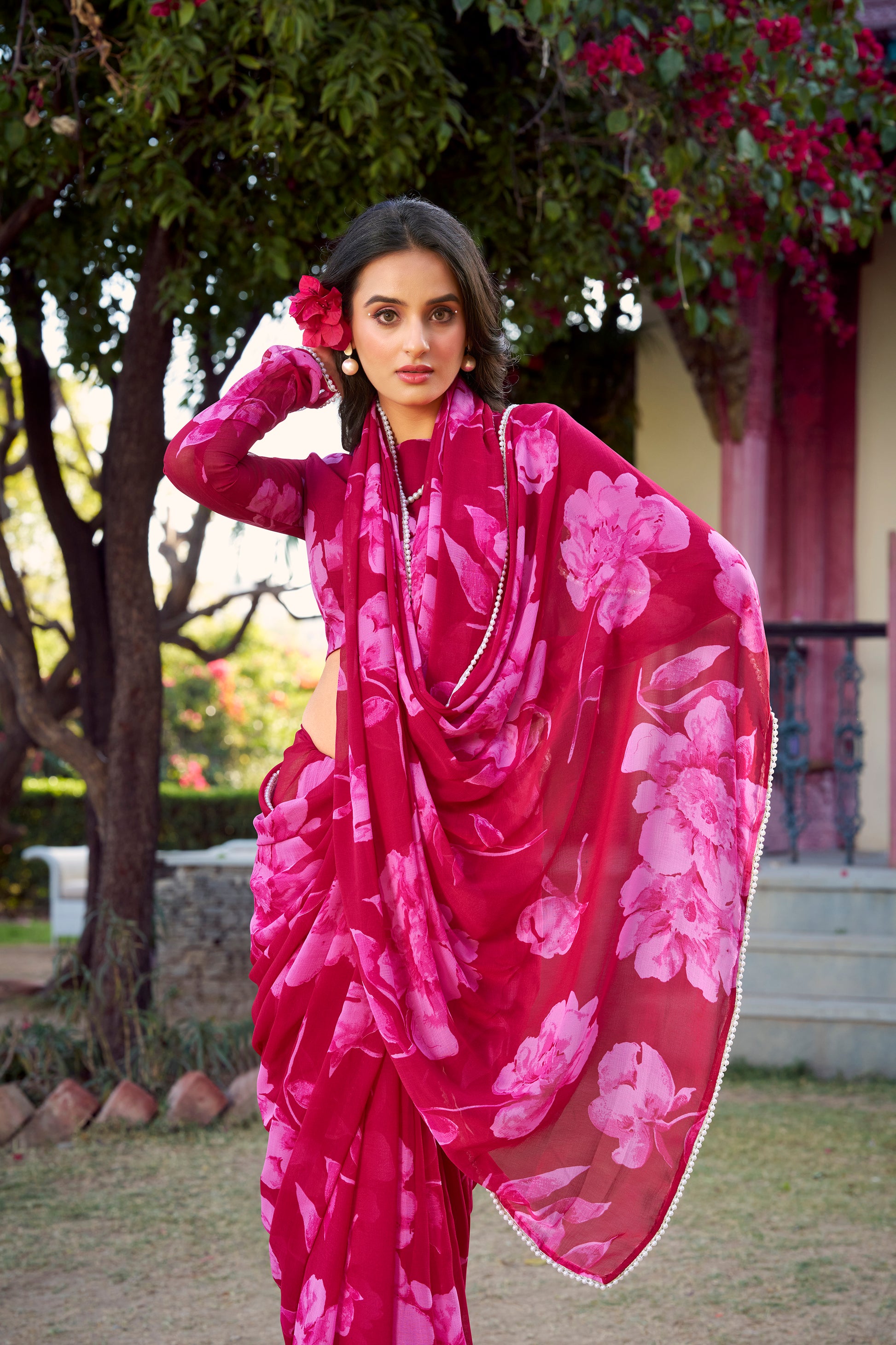 Elegant Floral Saree in breathable blue fabric with pearl accents.