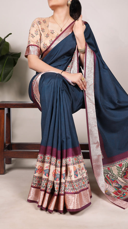 Blue tasar silk saree with printed border and floral blouse.