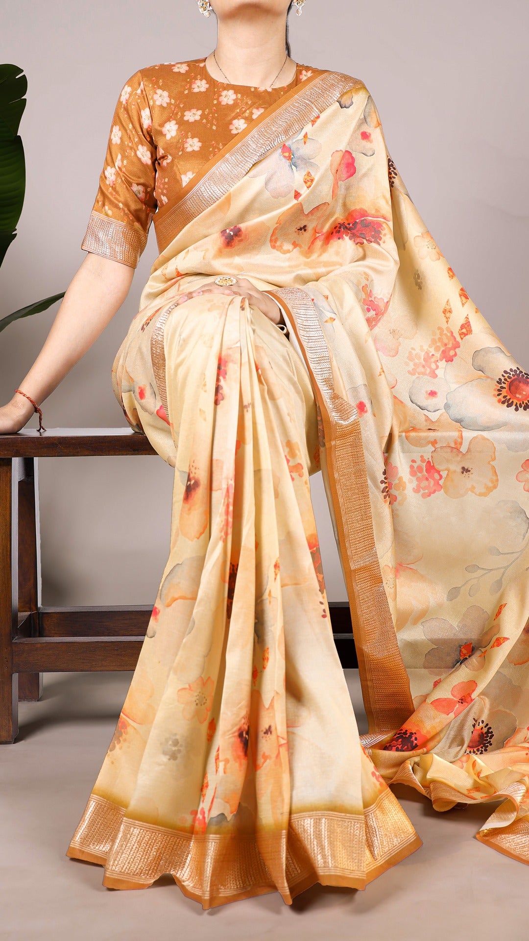 Model wearing a floral printed Tussar silk saree in shades of blue and white.