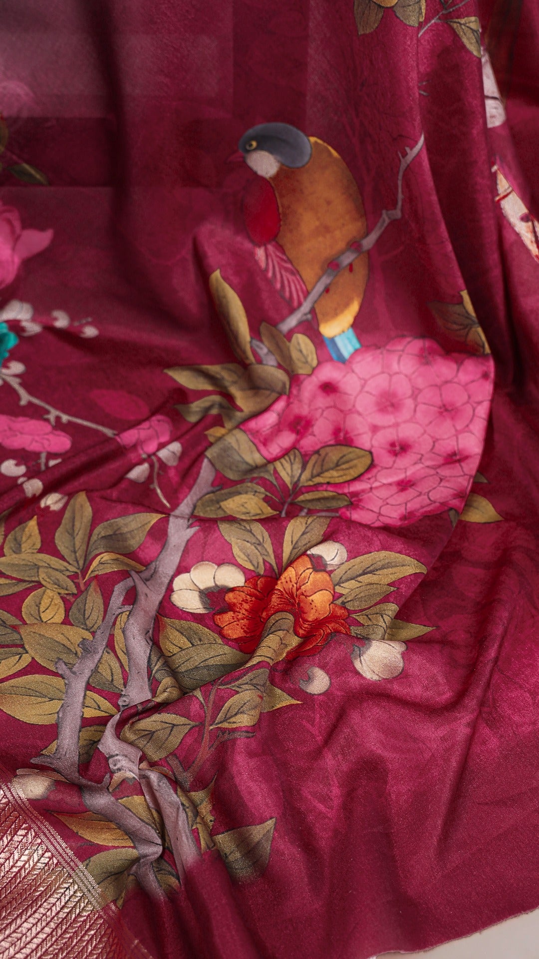 Full view of a woman draped in a stylish blue and white floral printed Tussar silk saree.