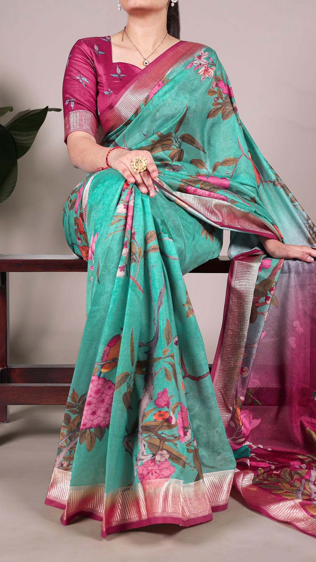 Model wearing a floral printed Tussar silk saree in shades of blue and white.