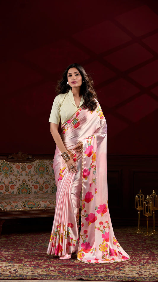 Model wearing a pink floral satin saree, perfect for special occasions.