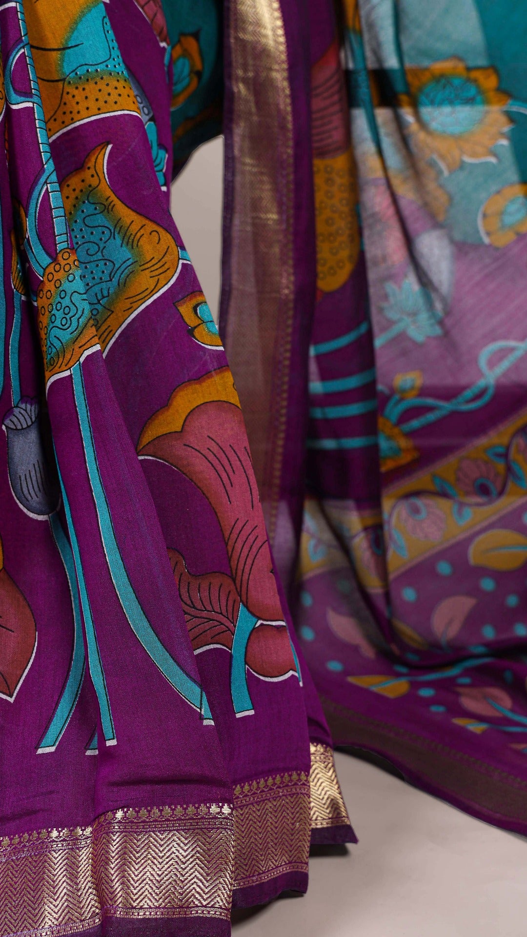 Detailed view of saree border with woven golden zari design.