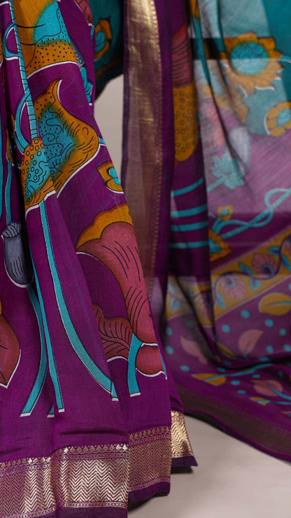 Detailed view of saree border with woven golden zari design.