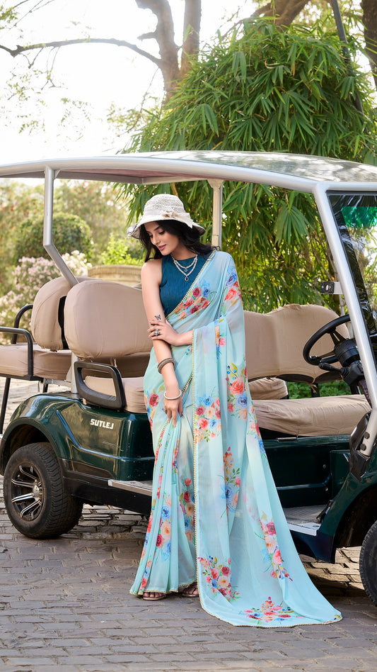Model in light blue floral printed saree with pearl lace border.