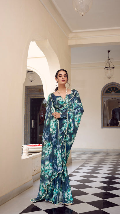 Model showcases drape and style of the lightweight blue floral saree.