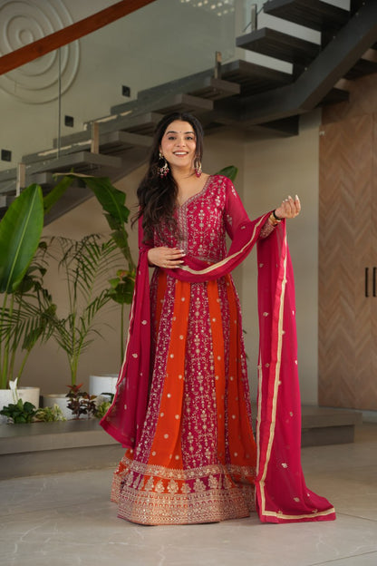 Full-length view of woman in pink and orange designer gown-dupatta set.