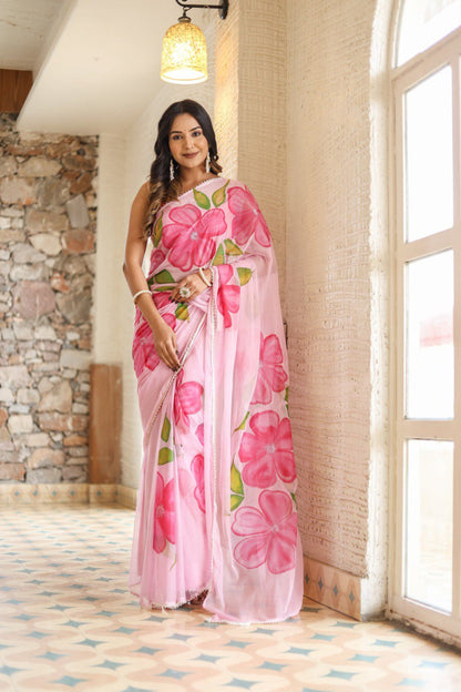 Full view of a woman wearing a ready-to-wear pink floral print saree.
