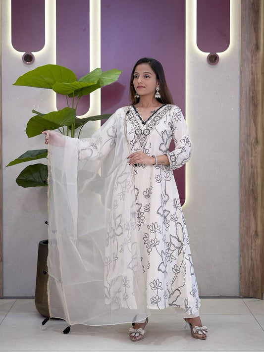 Elegant white Anarkali suit with black digital print and sheer organza dupatta.