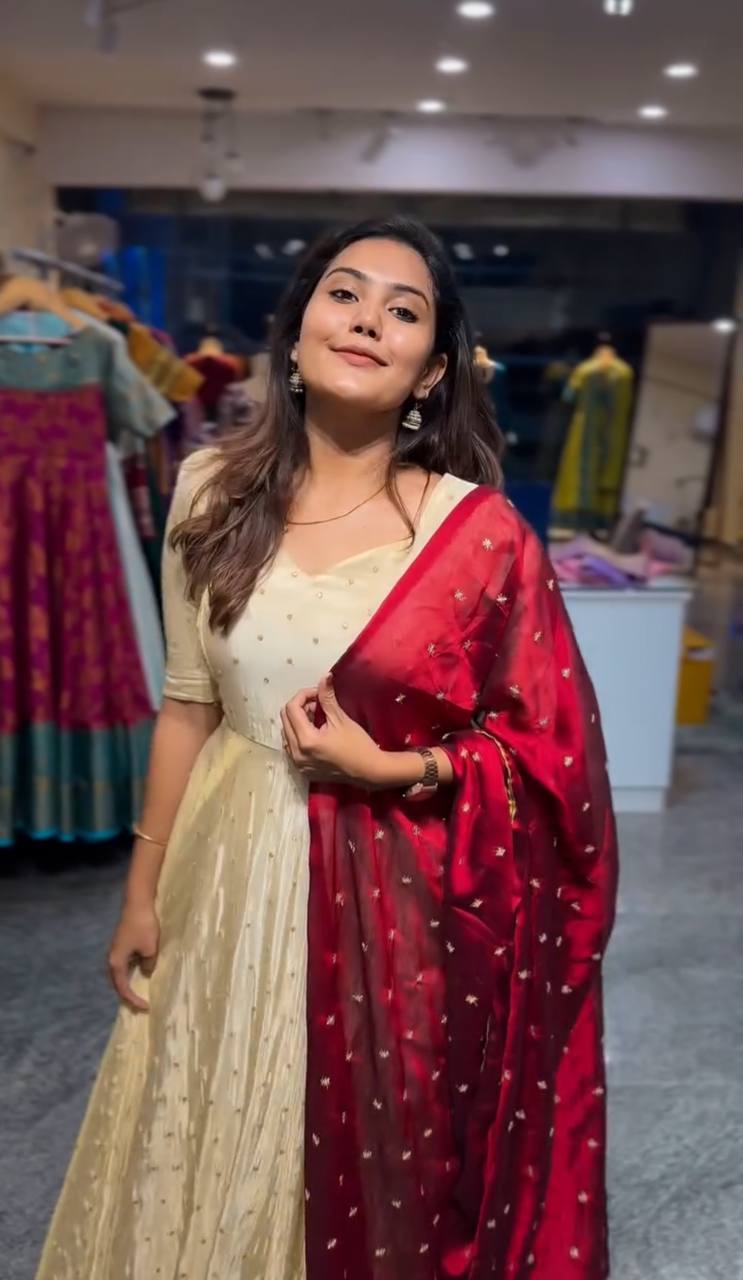 Model wearing Red Victoria Suit Set with embroidered dupatta.