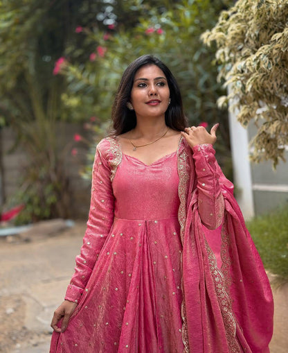 Model showcasing the elegant wine Anarkali gown and dupatta with gold accents.