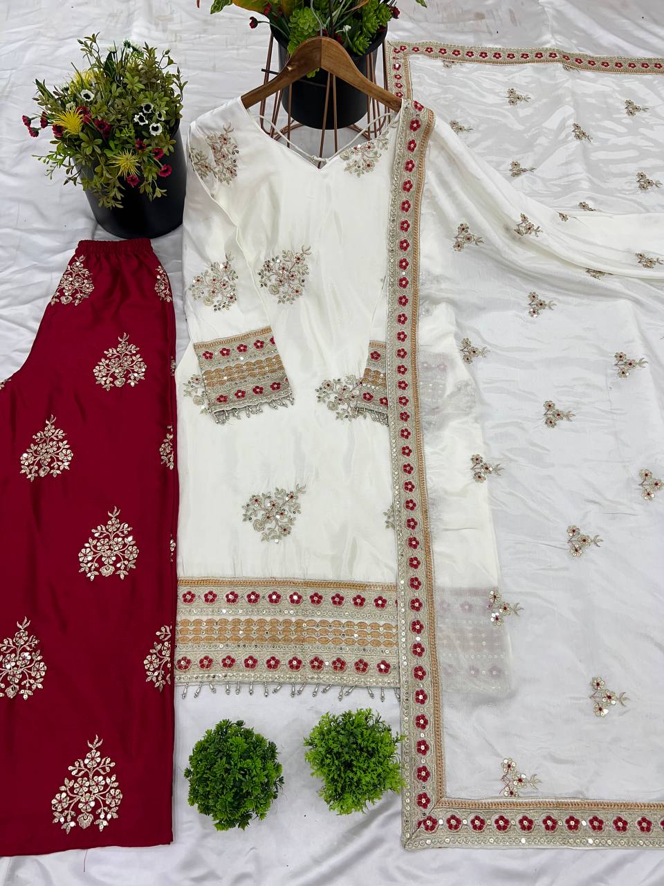 Rangbhoomi's Silk Splendor Party Wear set in white and maroon, laid flat.