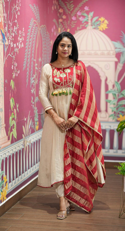 Festival Special Off-White Intricate A-Line Kurti with Flared Pants and Brick Red & Gold Striped Dupatta