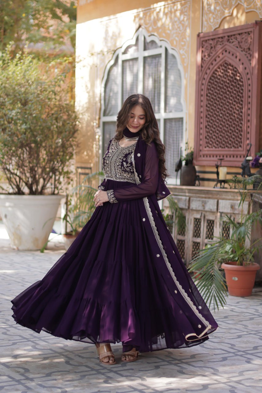Designer purple Georgette gown with intricate pearl work.
