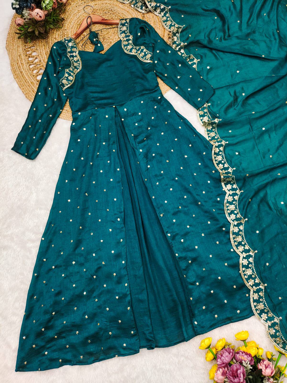A sophisticated wine Anarkali gown featuring gold embroidery and a matching dupatta.