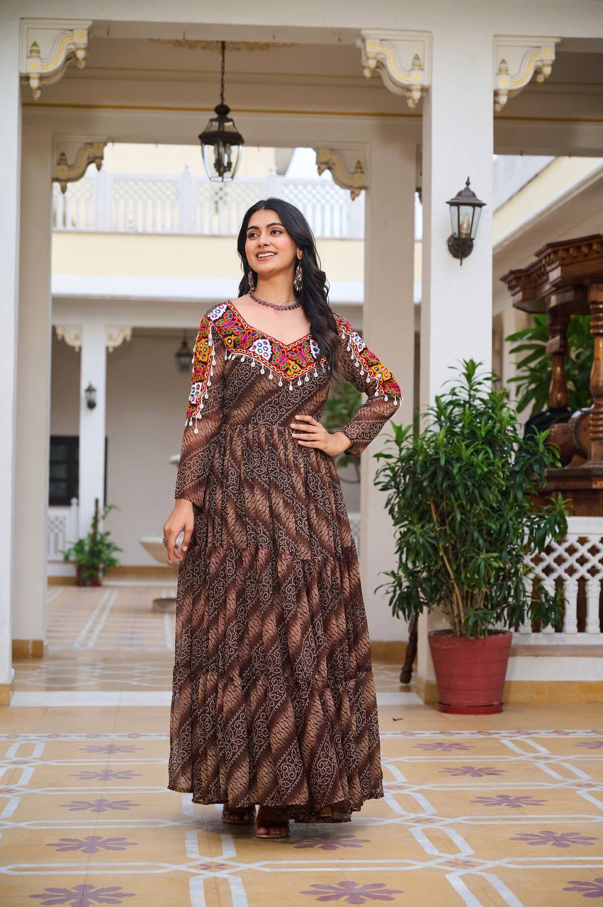 Brown Bandhni faux georgette gown with colorful embroidered yoke and mirror embellishments, front view.