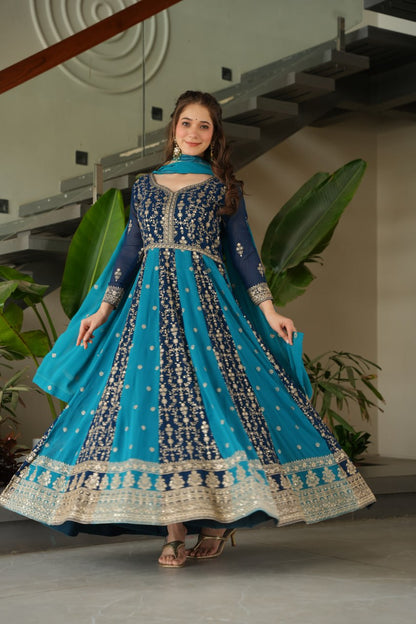 Woman in a blue and gold gown, showcasing the full flair and design.