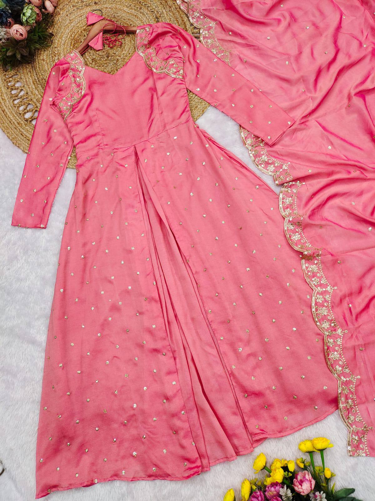 Detailed embroidery on a wine Anarkali gown with flared silhouette.