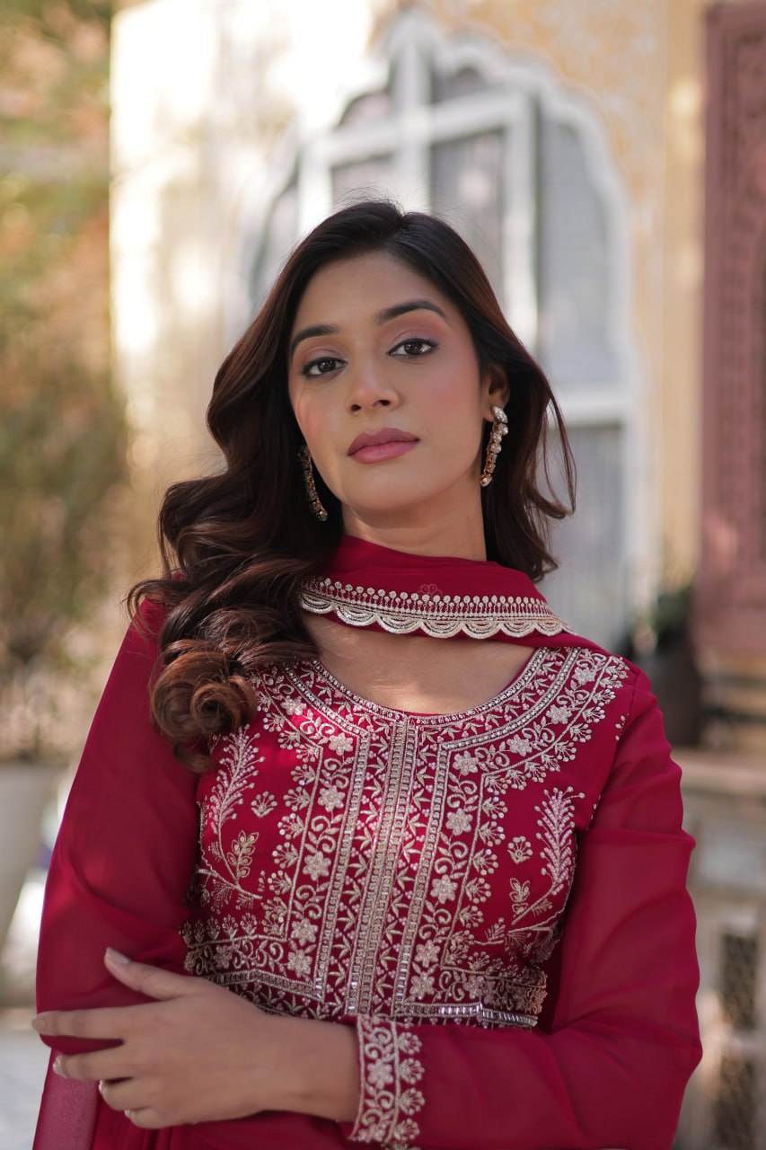 Close-up of the pearl embroidery on the red Georgette gown.