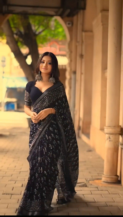 Close-up of black and white printed ready to wear cotton saree.