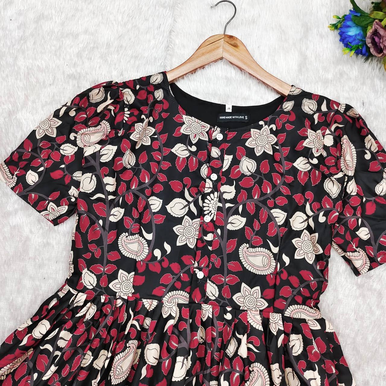 Close-up shot of the Kalamkari maxi dress, emphasizing the beautiful floral print.