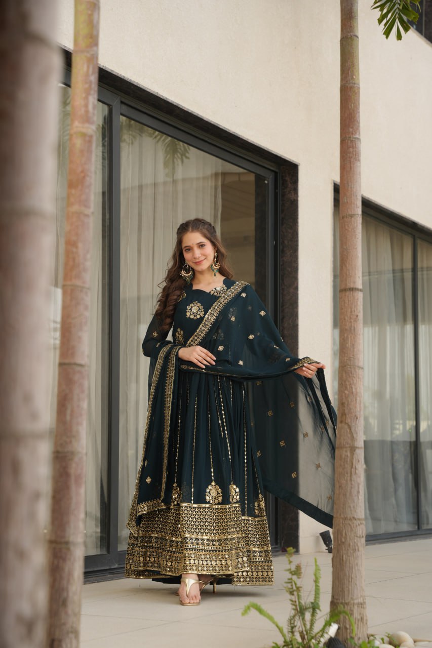 Model in a Rama green gown with dupatta, outdoor photoshoot.