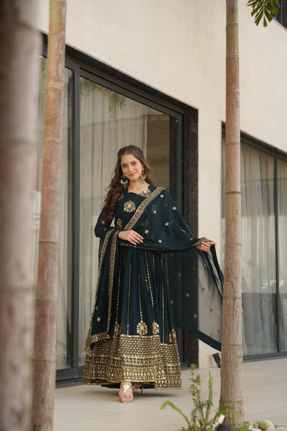Model in a Rama green gown with dupatta, outdoor photoshoot.