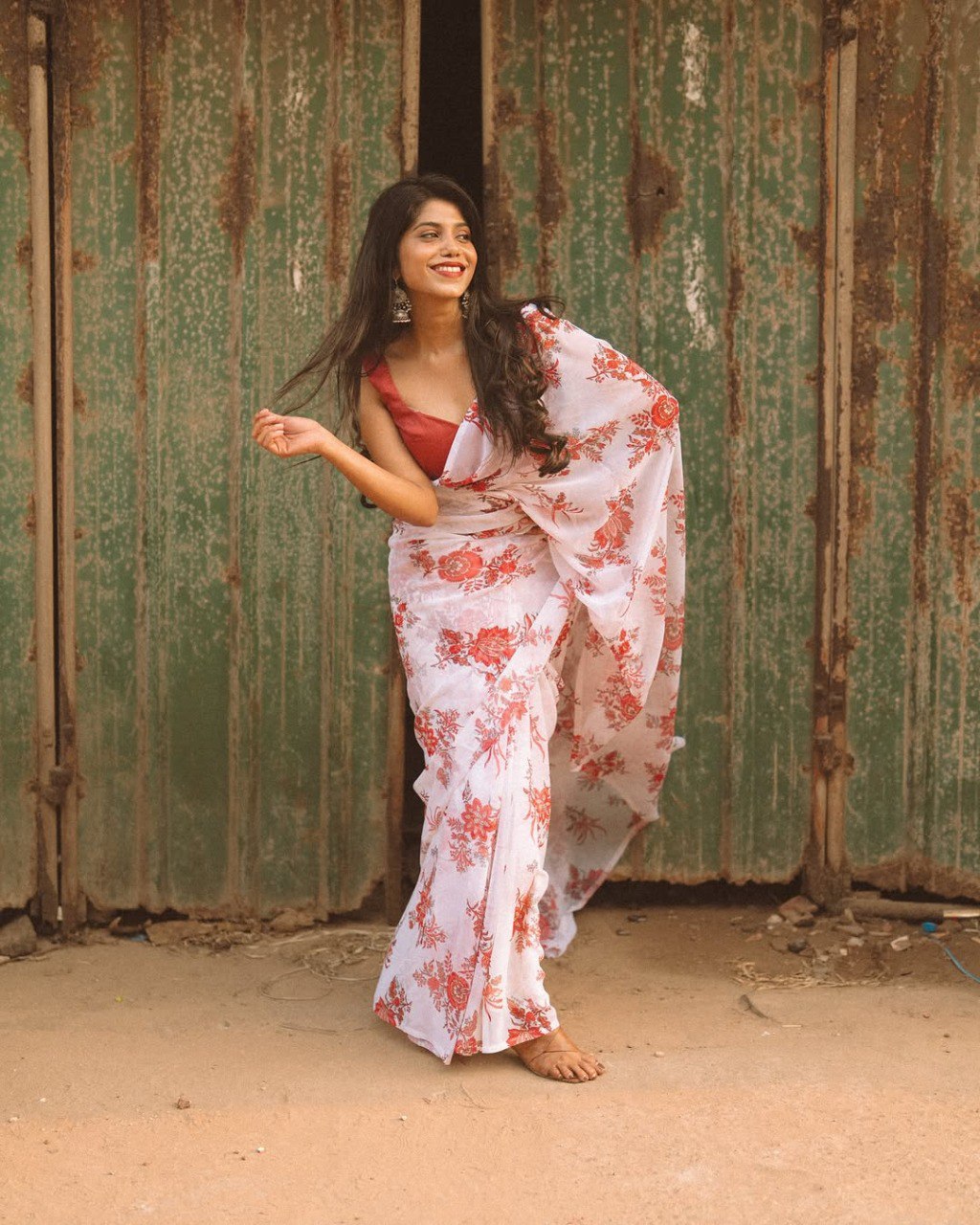 Off-white georgette saree with red floral print, ready to wear style.