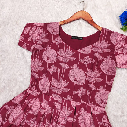 Maroon Lotus dress, close-up of the lotus floral pattern and neckline. Beautifully crafted dress.