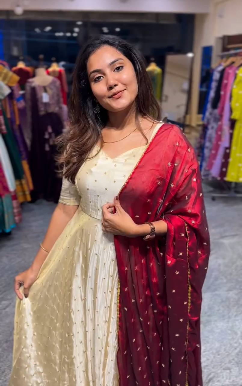 Model wearing Red Victoria Suit Set with embroidered dupatta.
